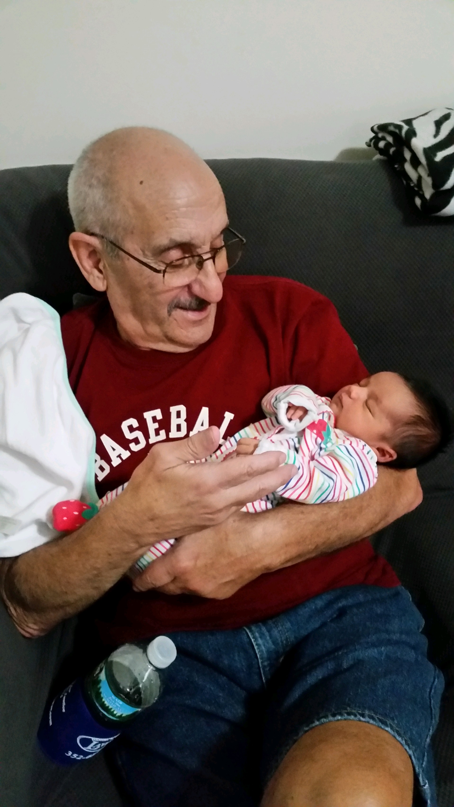 Rich Karam holding his grandchild.