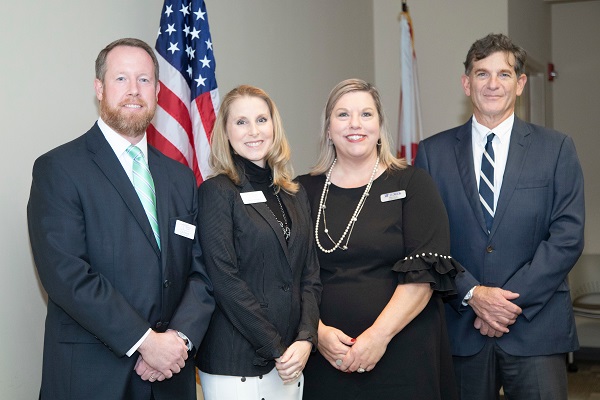 Child Advocacy Center Chair Lem Purcell, CAC President and CEO Sherry Kitchens, UF Child Protection Team Assistant Director Stephanie Cox and UF Pediatrics Chair Dr. Scott Rivkees gather before the official announcement of the co-location between the groups.