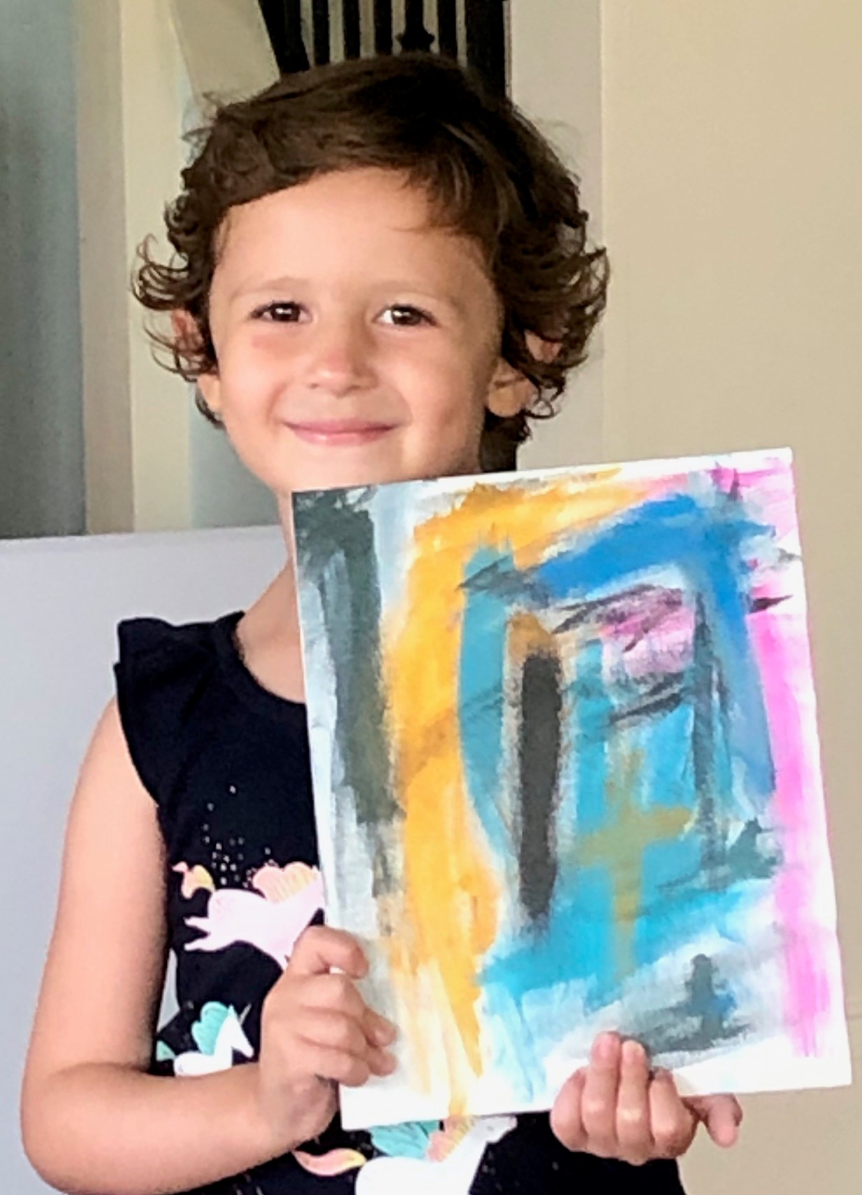 Josie Macchio poses with a painting