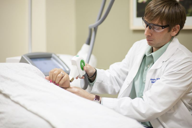 UF Health Dermatology doctor performing laser treatment