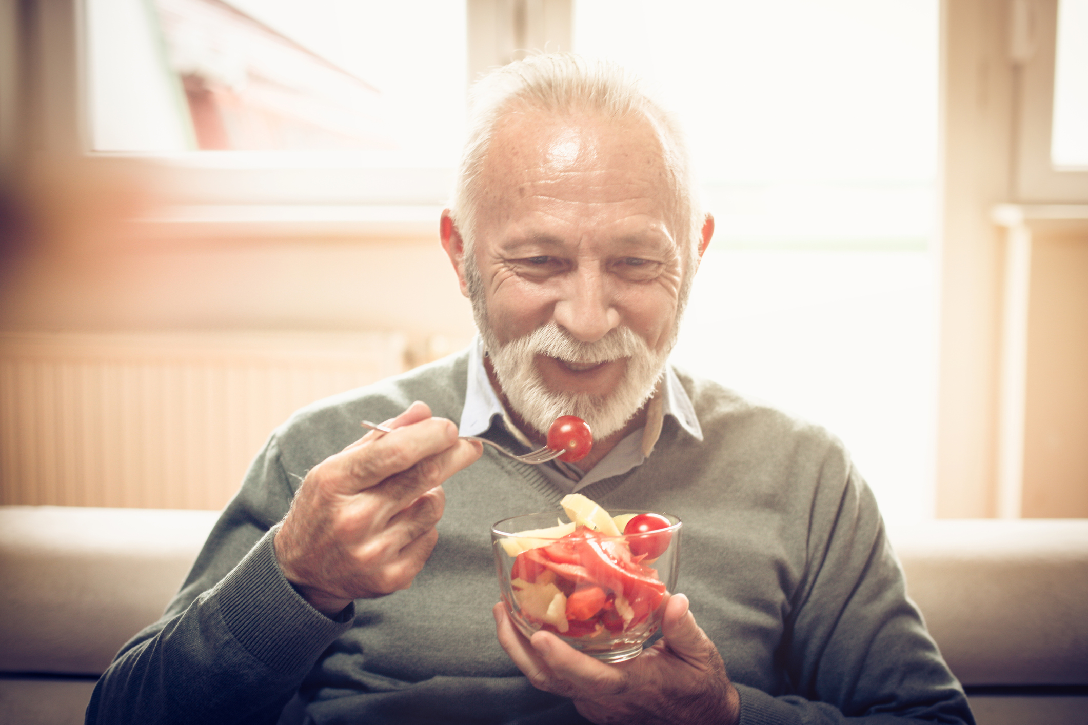 Older man eating food