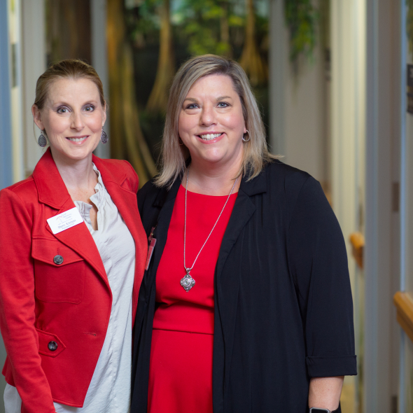 Sherry Kitchens (left), president and CEO of the Child Advocacy Center of Gainesville, and Stephanie Cox, assistant director of the UF Child Protection Team, stand together at the University of Florida Health Pediatrics – Gerold L. Schiebler CMS Center, where the two groups have offices.