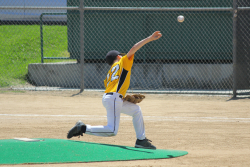 A youth baseball players throws during a game. UF Health physicians note that even youngsters can encounter arm overuse injuries requiring surgery, just like college and major league pitchers. (Getty Images)