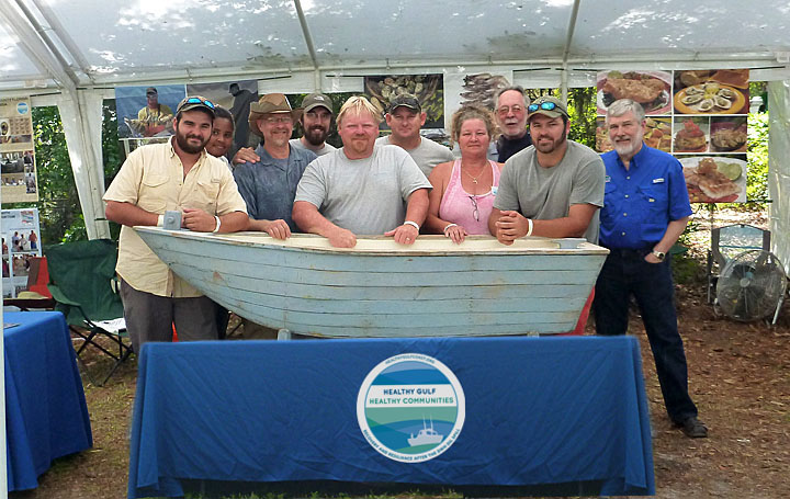 Drs. Morris (EPI director, far right) and Kane (Aquatic Pathobiology Laboratory director, third from left) are joined by graduate students and seafood workers from Apalachicola and Steinhatchee at the 2013 Florida Folk Festival. Their outreach exhibit highlighted the Healthy Gulf Healthy Communities project, and showcased heritage oyster and stone crab fisheries with demonstrations and tastings for more than 20,000 festival-goers.