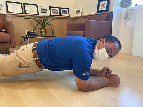 UF Health Shands CEO Ed Jimenez displays proper planking technique.