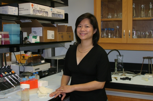 Emina Huang, M.D. in the lab