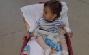 A photo of Kash Hill in an infant's wheeled device
